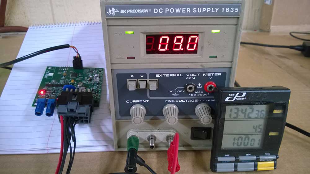 Testing equipment connected to a PCB board DC power supply, measuring 9.0V during the final stage of laboratory validation.